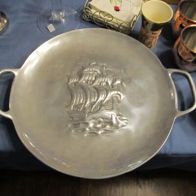 Pewter serving tray with handles.