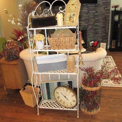 Lovely folding bakers rack in white. We have a large selection of well-made baskets and beautiful decor.