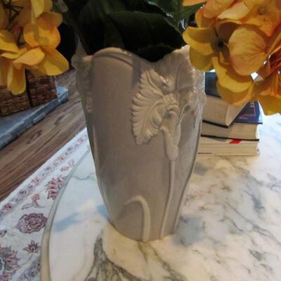 A stunning Italian vase w/ flowers.