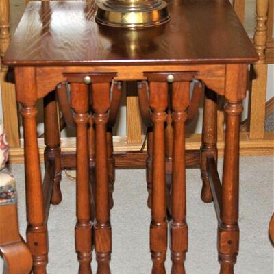 Unique solid wood end table with two pull out nesting tables.
