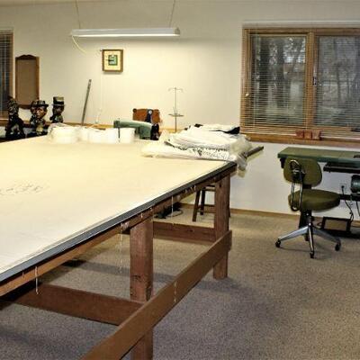 Everything in this custom workroom is for sale including the padded tables.