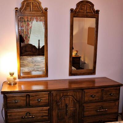 Large bedroom dresser with two mirrors.