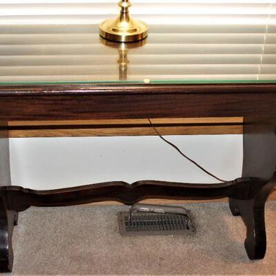 Solid wood accent or sofa table with glass top.  A very versatile piece.