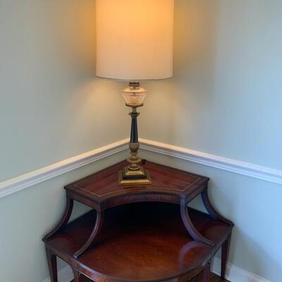 Rembrandt table lamp with milk glass diffuser
mahogany corner table with leather insets