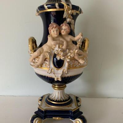 Antique Royal Dux covered urn with cherubs
