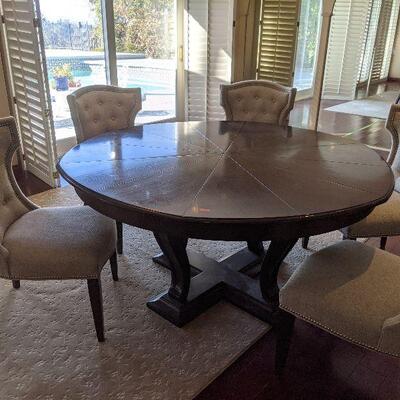 Fantastic Metropolitan round to round expandable table 60-72 inch diameter.  Red tag $575  Retails new for $4,200
