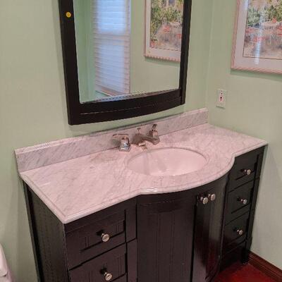 Marble top cabinet with mirror $275.  (Owner will remove for buyer).