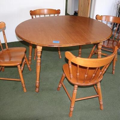 Vintage dining table with four chairs
