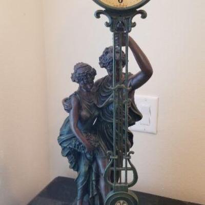 Vintage figurine with clock