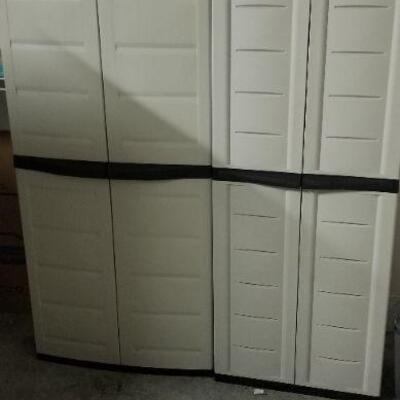 two plastic storage cabinets, garage kept