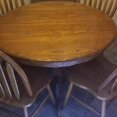 Round Oak dining room table and six chairs