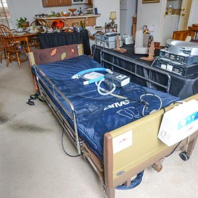 Invacare hospital bed with mattress and rails