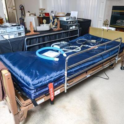 Invacare hospital bed with mattress and rails 
