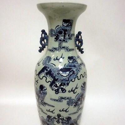 1035	LARGE ASIAN POTTERY URN WITH DRAGONS
