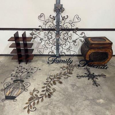 Six pieces of metal hanging decor and two wooden decor pieces. Largest piece 40 x 40