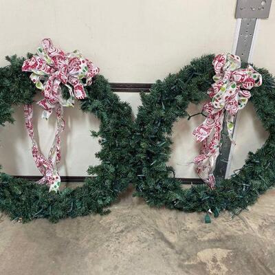 Two gorgeous large Christmas wreaths with beautiful handmade bows and pre-lit. 30 in diameter....