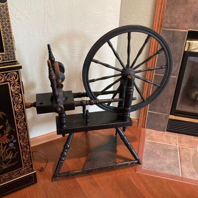 antique black spinning wheel..