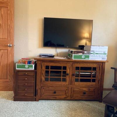 Small stand to the left, Samsung TV & cabinet