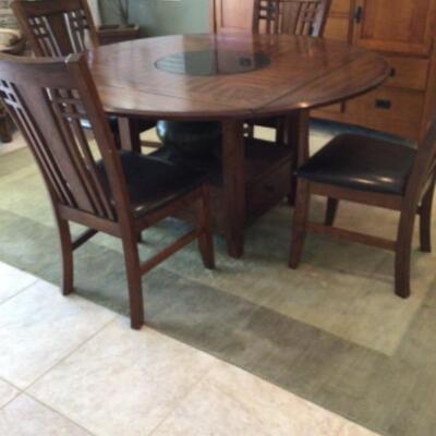 Mission style dining table has built in Lazy Susan. Also available matching buffet cabinet