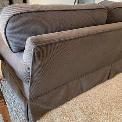 Vintage Baker sofa newly reupholstered in charcoal ribbed fabric. Measures 84