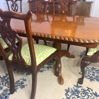Vintage dining table with double pedestal base extends to 10' shown with 8 vintage dining chairs. Dining table measures 44