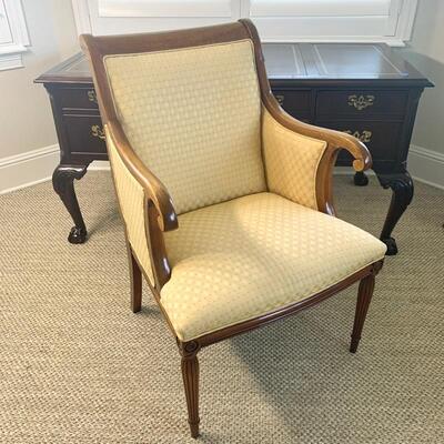 Gold upholstered wooden arm chair measures 26" x 26" 38"