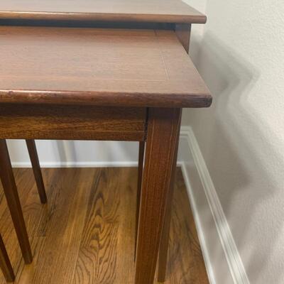 Vintage 2PC nesting table set. Large table measures 19.5" x 16" x 27". Small table measures 16" x 16" x 26"
