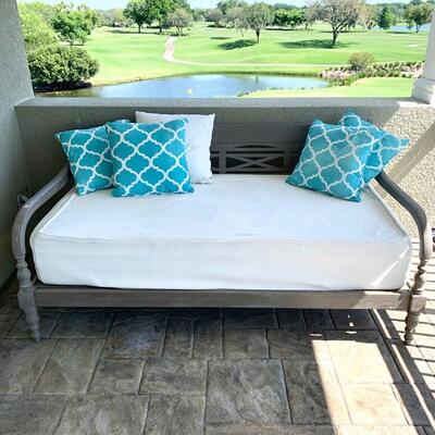 Indonesian rubberwood daybed with covered mattress for outdoor use. Measures 77