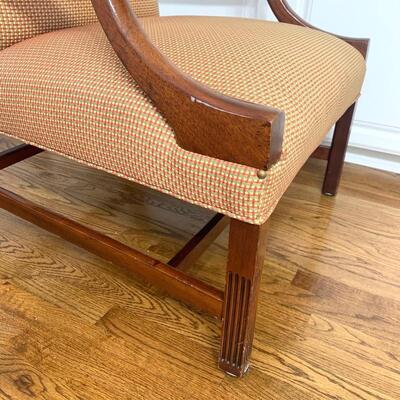 Red/green/gold upholstered wood arm chair measures 29" x 28" x 40"