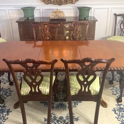 Vintage dining table with double pedestal base extends to 10' shown with 8 vintage dining chairs. Dining table measures 44