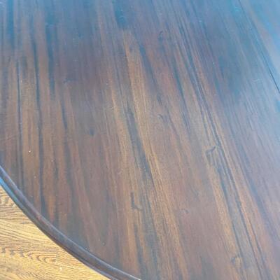 Round pedestal table measures 46" in diameter and 30" high