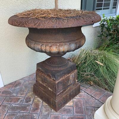 PAIR OF URNS AVAILABLE
Antique cast iron planter urn atop a pedestal. The urn measures 29