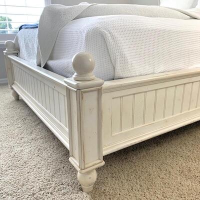 American Signature white distressed queen bed frame available with matching dresser.