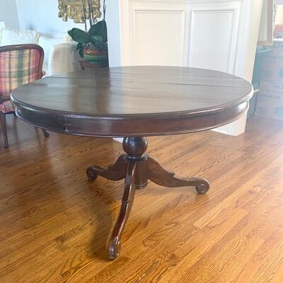 Round pedestal table measures 46" in diameter and 30" high