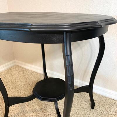 Black painted occasional table measures 26