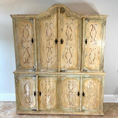 Hand painted distressed 2PC imported cabinet. Bottom piece measures 72" wide and 36.5" high. Top piece measures 69" wide...