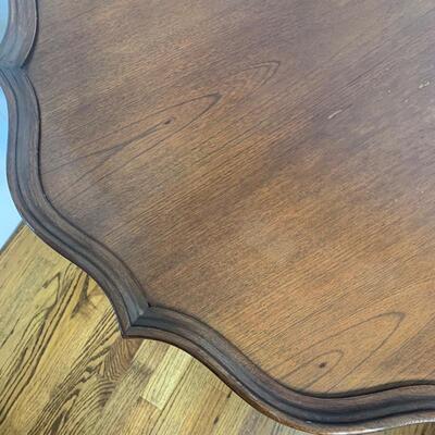 Scalloped edge pedestal table measures 30" in diameter and 28.5" high