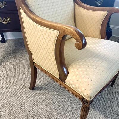 Gold upholstered wooden arm chair measures 26" x 26" 38"