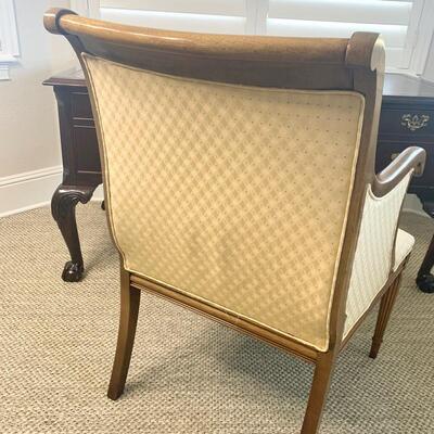 Gold upholstered wooden arm chair measures 26" x 26" 38"