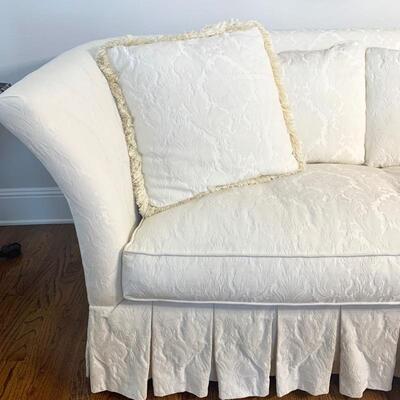 White damask sofa/loveseat measures 75" long and 37" deep