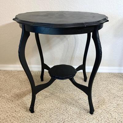 Black painted occasional table measures 26