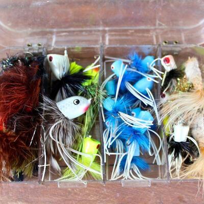 Many fly fishing flies, sinkers, leader line, bait, spoons, spinners, etc., for your fishing enjoyment.