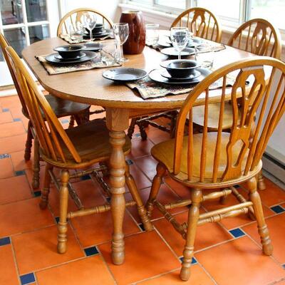Cochran Furniture dining set - round table expands to accommodate 6 Windsor style chairs with the addition of 2 leaves.