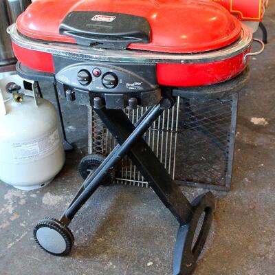 Never used!  Coleman Road Trip Grill - rolling camp/picnic grill, and below, folding campfire grate.