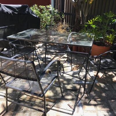 metal table with glass and set of 4 chairs $280
table 48 1/2 X 28 1/1 X 29