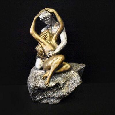 Man Holding A Woman Figurine - 15
