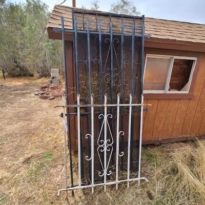 4002	

2 Peieces Of Rod Iron Fence And Metal Security Door
Door Measures Approx: 32
