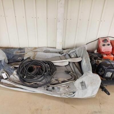 6026	

Inflatable Boat. Outboard Motor
4 Gas Tanks & Fuel Lines