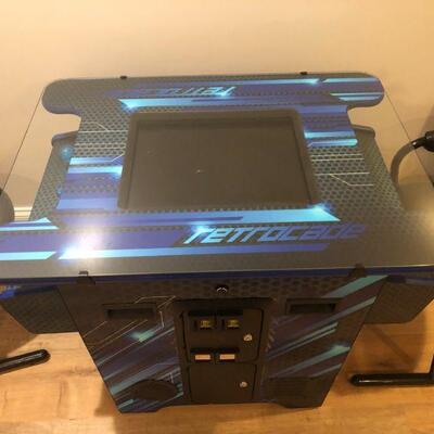 Classic cocktail table arcade with all the good oldies.! Working order. Two chairs. $725 Still selling for $1400 new