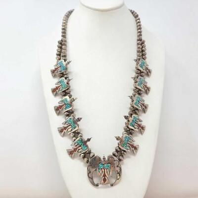1180	

Vintage Sterling Silver Thunderbird Squash Blossom with Turquoise and Coral Inlay, 126.2g
Weighs approx 126.2g
Measures approx...